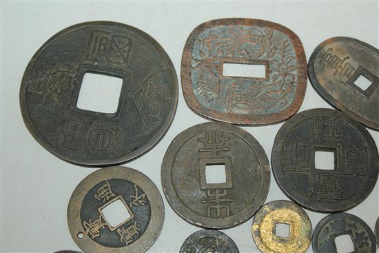 A collection of Japanese mon and half-shu coins and Chinese bronze and copper coins, 15th-19th century (23)